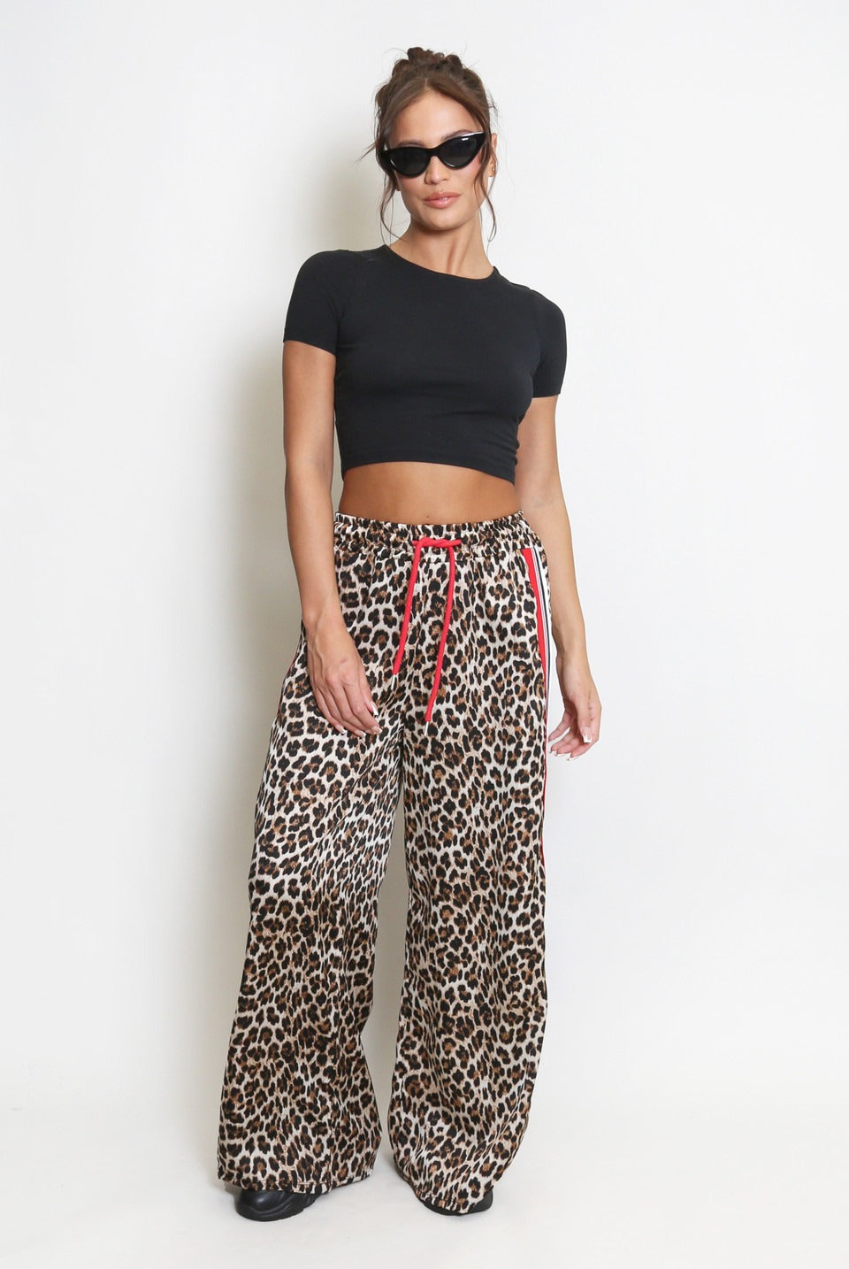 Leopard print trousers with red stripe on sale